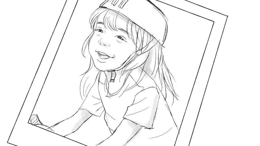 A polaroid of a girl in a helmet, laughing.
