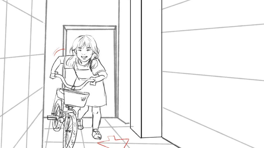 A father runs beside a child learning to ride a bicycle.