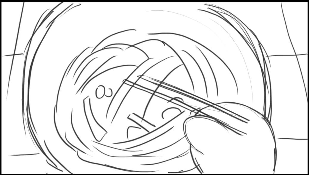 A bowl from above with chopsticks lifting noodles in a swirl.