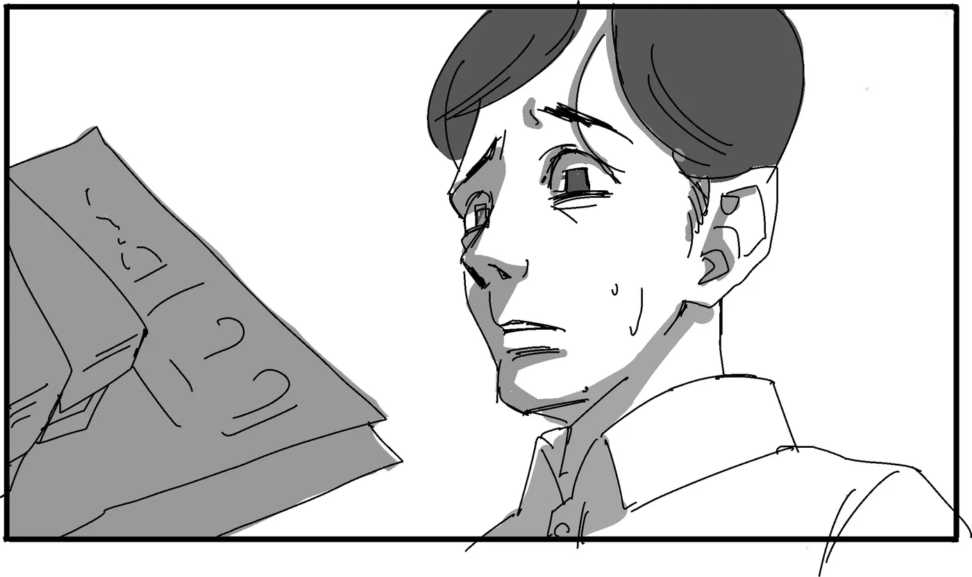 Close-up of the boy looking down at a document.