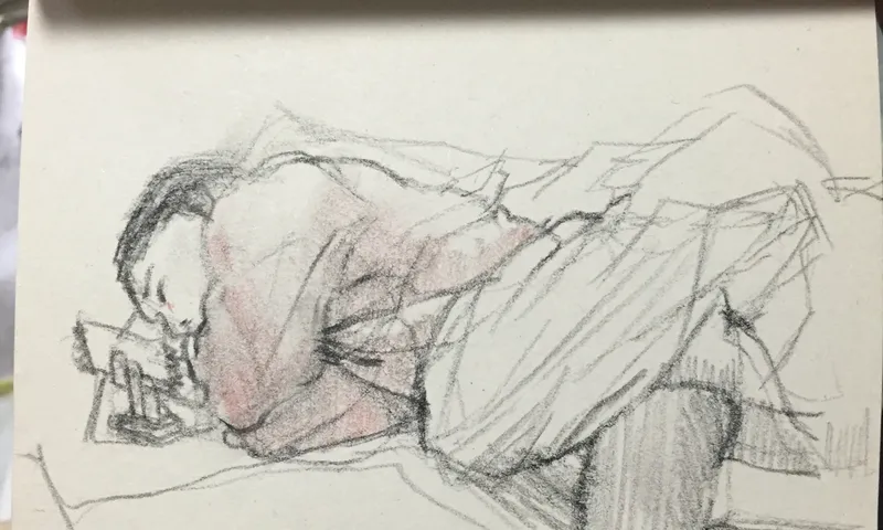 Pencil: a person lying face-down on a bed, reading.