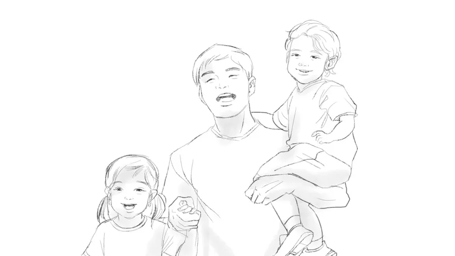 A father holding a child, with another child beside him, facing the camera.